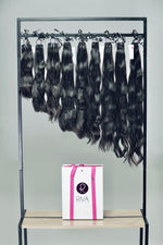 Natural straight human hair extensions hanging – 100% real hair
