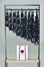 Natural straight human hair extensions hanging – 100% real hair