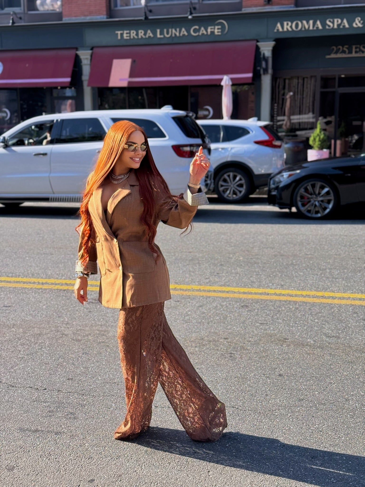 Woman wearing a long copper brown human hair wig