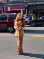 Woman wearing a long copper brown human hair wig